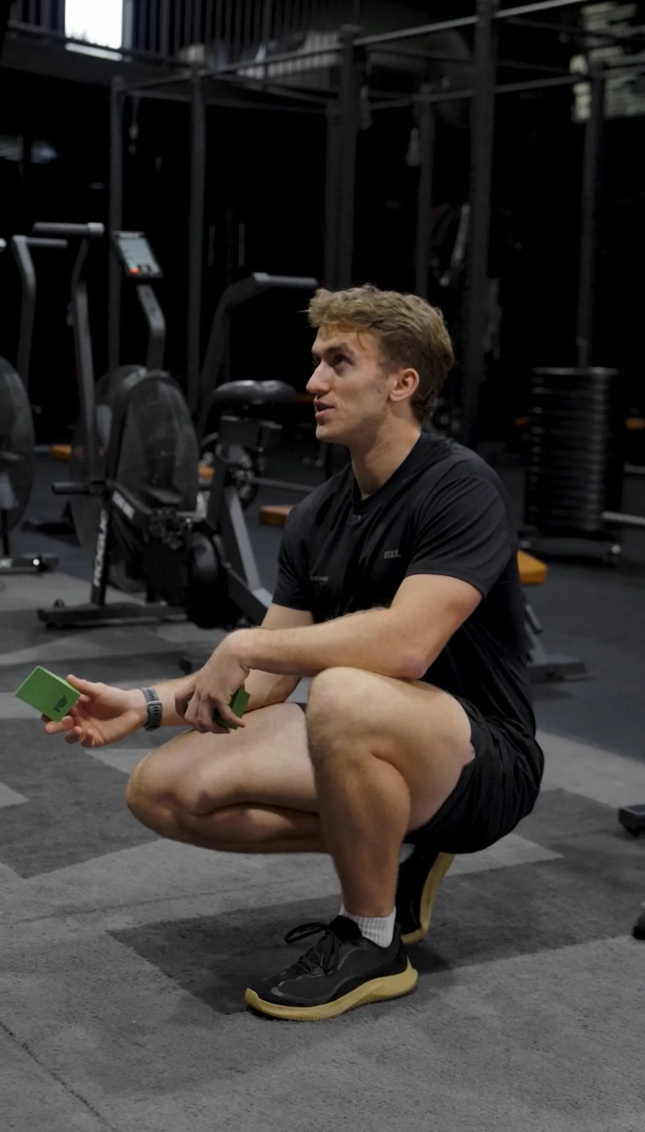 Felix coaching a client through an exercise in the gym
