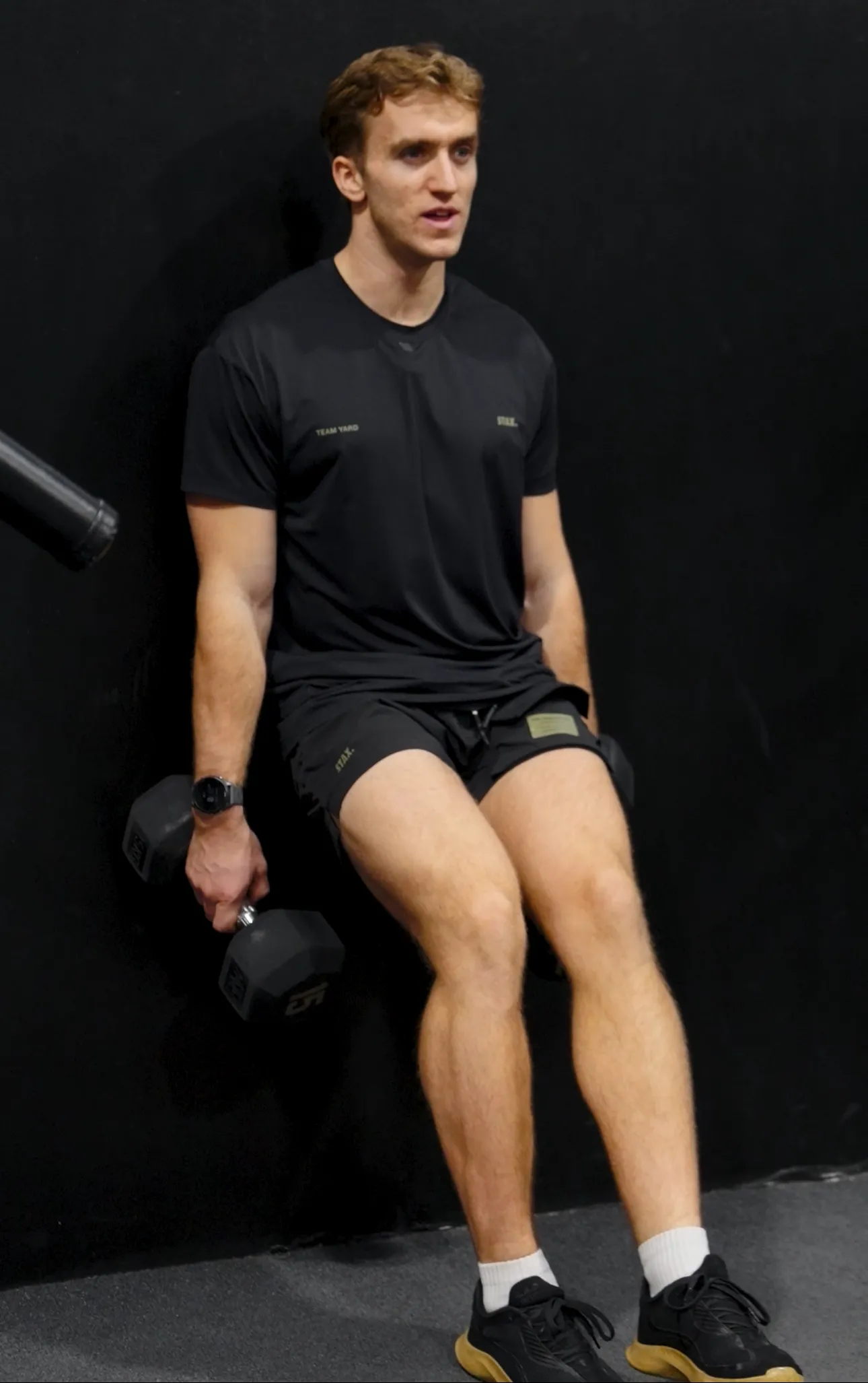 Felix demonstrating a strength exercise in the gym