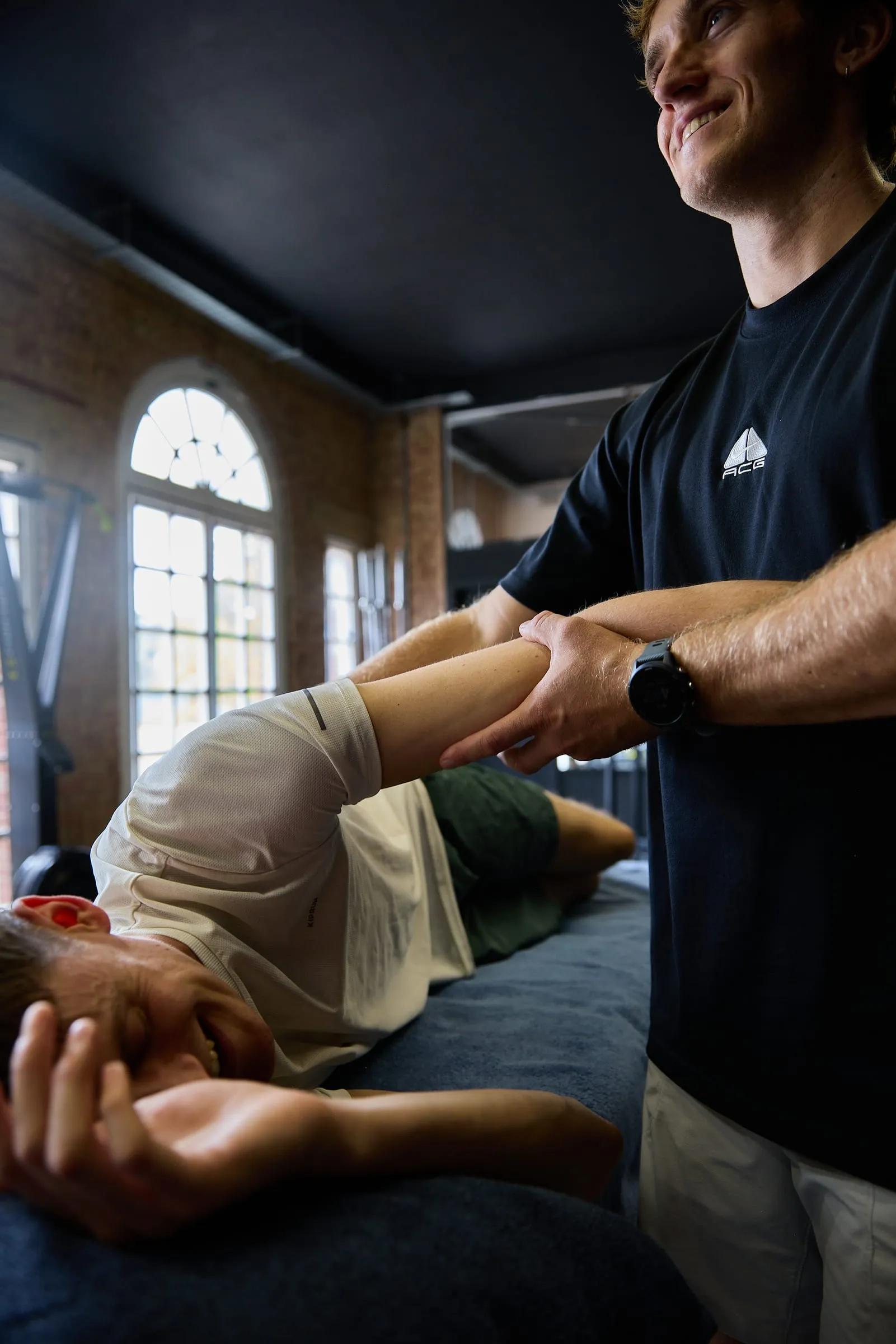 Felix mobilising a client's leg during an osteopathy treatment
